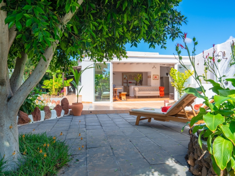 The kitchen terrace flows into the garden